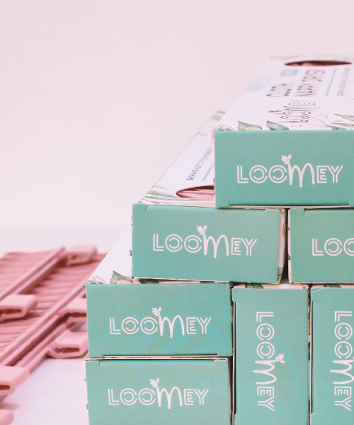 Boxes of Loomey Cloth Nappy Dryer on their side. 